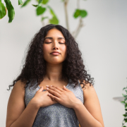 Woman using breathing techniques to control anxious breathing