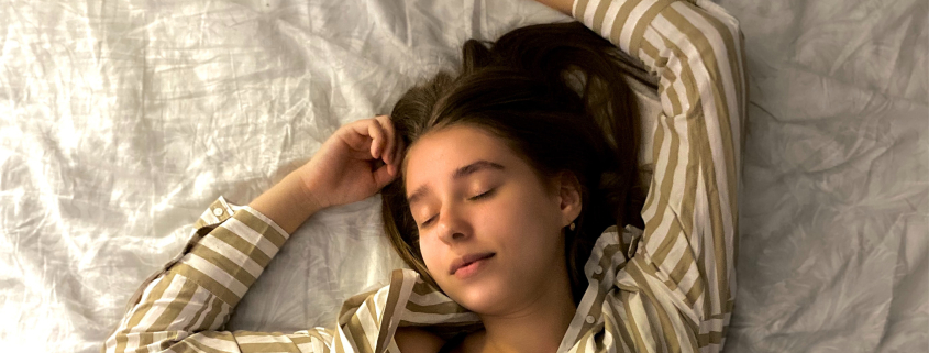 Woman sleeping on bed