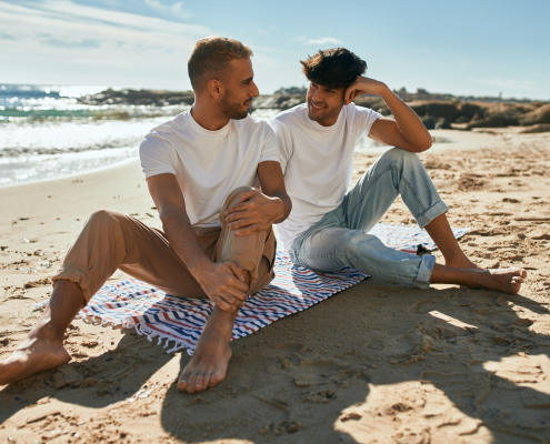 Young gay couple at beach