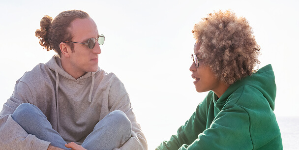 A man and woman talking